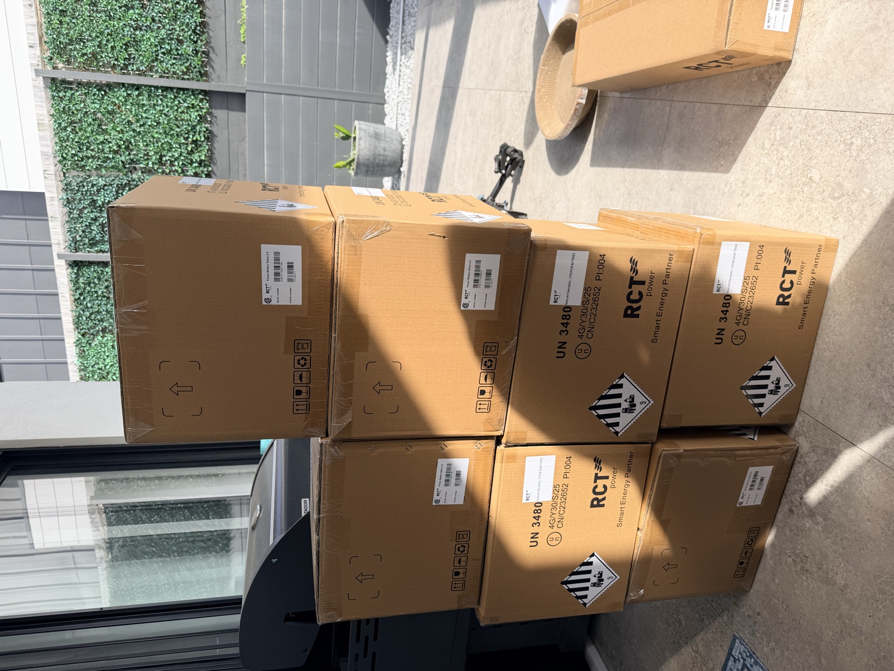 RCT Power battery cartons staged on the patio